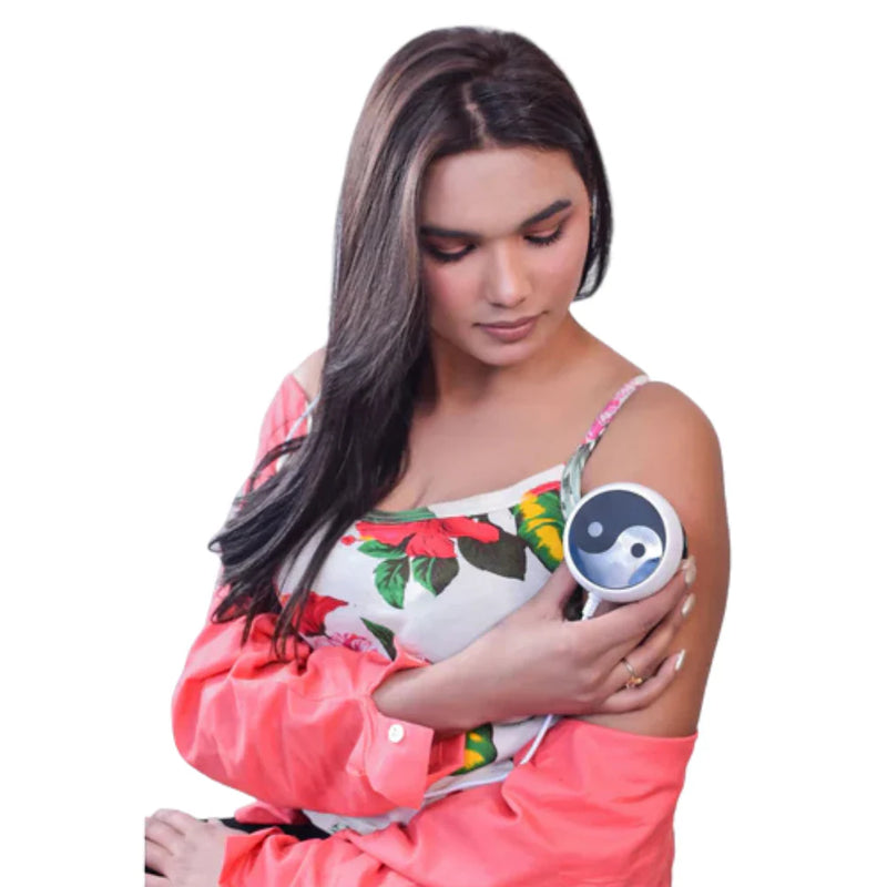 Woman applying a cupping massager to her arm on a white background
